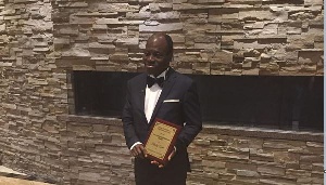 Joe Kingsley Eyiah with his Educational Excellence Award