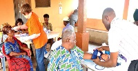 Senior citizens receiving healthcare.