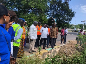 Martin Adjei Mensah Korsah inspecting work at the drainage system in front of GBC