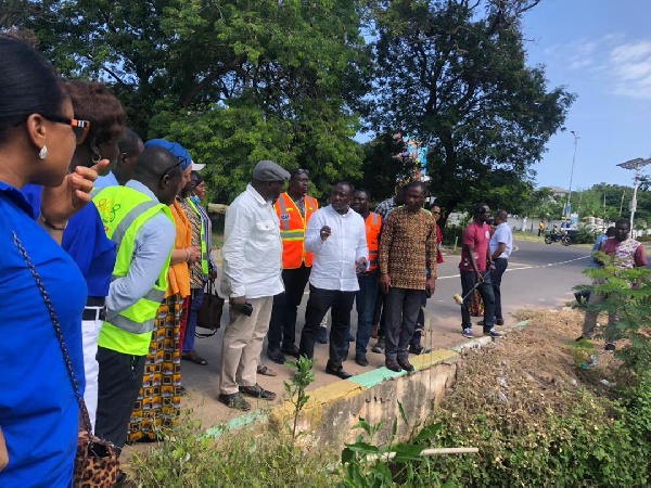 Martin Adjei Mensah Korsah inspecting work at the drainage system in front of GBC