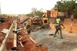 Workers at road construction site.      File photo