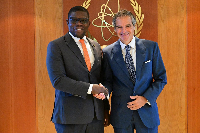 Richard Gyan Mensah (L) in a handshake with a US official