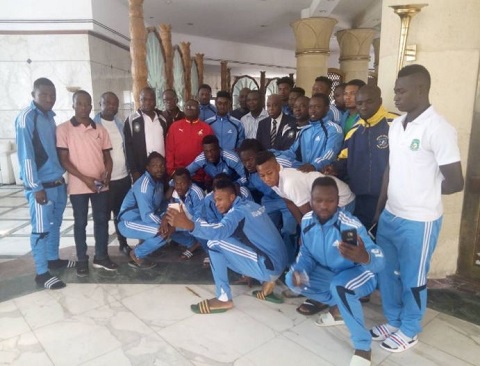 Aduana Stars team with Ambassador Paul Okoh  in suit