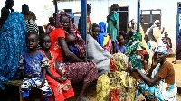 People gather at camp for South Sudanese refugees in Sudan's White Nile state in September 2021