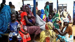 People gather at camp for South Sudanese refugees in Sudan's White Nile state in September 2021