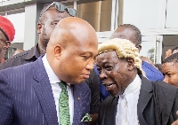 Samuel Okudzeto Ablakwa with his lawyer after the proceedings of the day