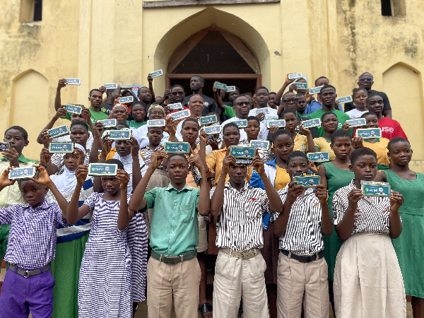 Students in the Ho West Assembly showcasing their maths sets donated by Nuse Foundation