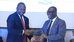 UMB CEO, John Awuah and William Oppong-Bio, Chairman, Central Sugar Co. Ltd exchanging plaque
