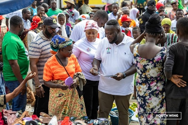 George Opare Addo interacting with a trader during the campaign