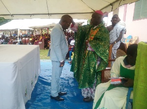 Rev. Bishop John Afoakwa praying for Asamoah Boateng