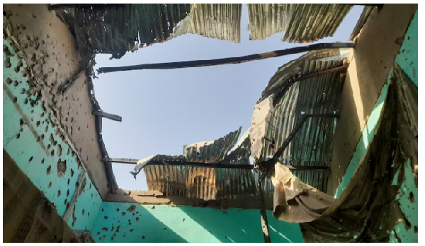 A ceiling damaged by shelling shrapnel at a displaced persons center in El Fasher, Sudan, October 7,