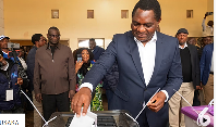 Zambia's President Hakainde Hichilema casts his vote at a polling station