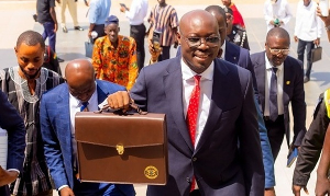 Minister of Finance, Dr. Cassiel Ato Forson with his brown bag