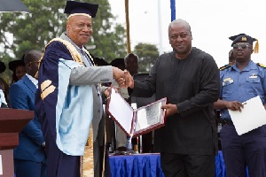 File photo: Former President John Dramani Mahama presents an award to Prof. Joshua Alabi