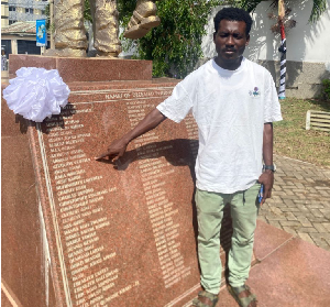 Emmanuel Clottey pointing to his dad’s name