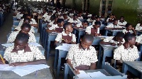 Some students writing examination
