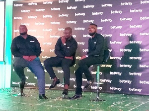 Stephen Appiah flanked by two reps from Betway company at the launch