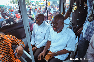 Minister of Transportation, Kwaku Ofori Asiamah with Dr. Dr. Mahamudu Bawumia in one of the buses