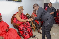 Dr Ernest Addison in a handshake with the Ga Mantse