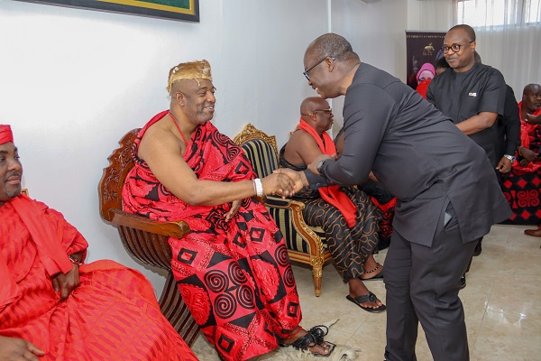 Dr Ernest Addison in a handshake with the Ga Mantse