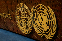 The logo of the International Court of Justice displayed on the judges' bench, The Hague