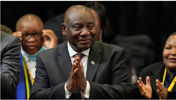 President Cyril Ramaphosa reacts after being re-elected during the first sitting