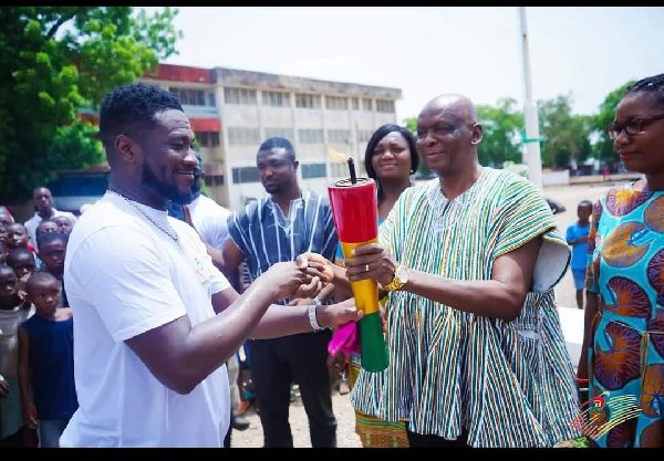 Asamoah Gyan with the torch