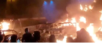 Burning vehicles were pictured in Tehran on Friday night