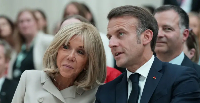 French President Emmanuel Macron  (left) and im wife Brigitte Macron