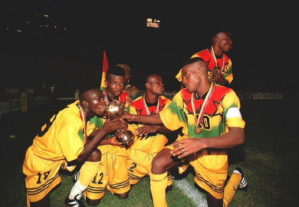 Ghanaian players celebrating with the trophy after the win