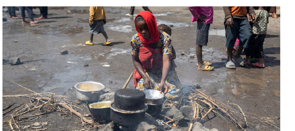 Elisabeth Rebeccah,22, prepares a meal at the Muchacha primary school