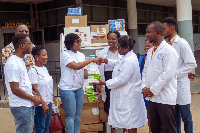 Team AmaCares presenting some items to officials of Ridge Hospital