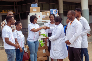 Team AmaCares presenting some items to officials of Ridge Hospital