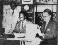 Kwame Nkrumah is captured here signing the pact with the US official, Peter Rutter