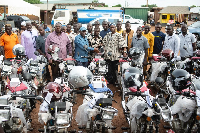 Ernest Agbesi presenting the motorbikes to the representatives of the constituencies