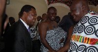 NHIS boss (L) in a handshake with Otumfuo Osei Tutu II, the Asantehene (R)