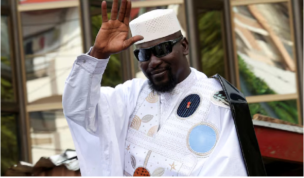 Guinean leader Mamadi Doumbouya waves after submitting his candidacy at the Supreme Court
