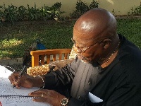 Dr Nyaho Tamakloe signing the petition book