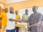 A picture of the leadership of the school receiving the items