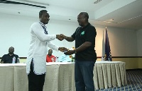 Samdakus in a hand shake with President  Mahama