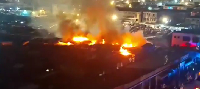 A picture of shops engulfed in flames at the Kumasi Central Market
