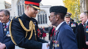 Prince Harry is seen here with World War II veteran, WOI Joseph Ashitey Hammond