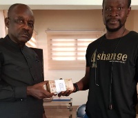 Lawal receiving the alleged bribe money from Mr. Bennet Aboagye
