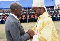 Veep Amissah-Arthur congratulating Most Rev. Richard Kuuia Baawobr