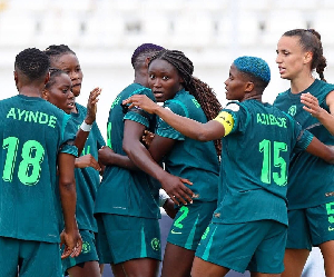 Players of Nigeria celebrating one of their goals against Zambia
