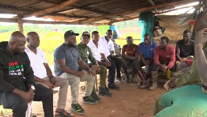 Some NDC members with galamseyers seated