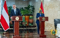 Austrian Chancellor Karl Nehammer (L) jointly addressing the press with President Nana Akufo-Addo (R