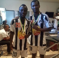 Solomon Asante (left) and Daniel Nii Adjei in the dressing room with their medals.