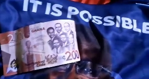 A GH¢200 note and a Bawumia branded t-shirt allegedly bing shared