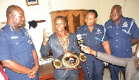 Dogboe explains a point to ACP Timothy Yooba Bonga while other officers present look on
